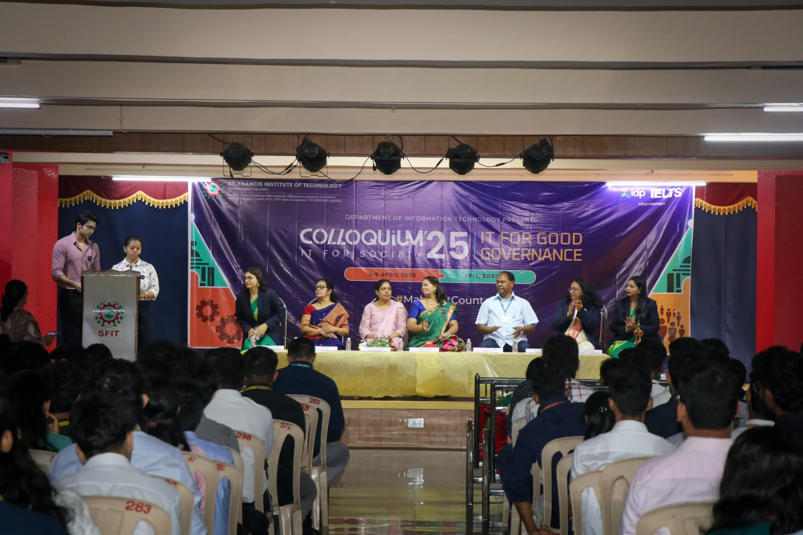 Dignitaries sitting on stage at SFIT auditorium.